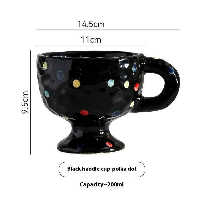 Hand-pinched irregular shaped ceramic mug in a solid colour, shown from the side.
