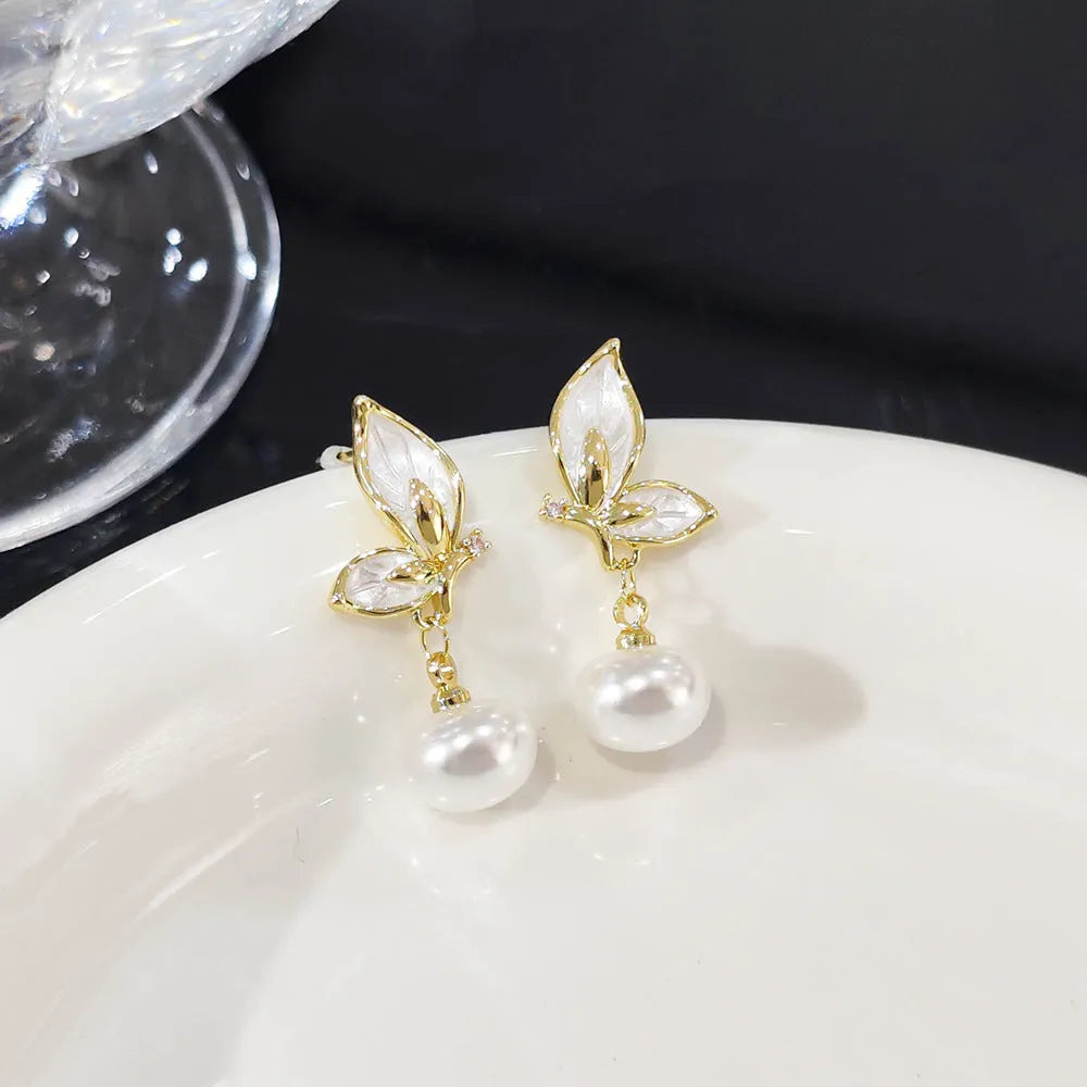 Gold-tone butterfly earrings with zircon painting detail on copper wings