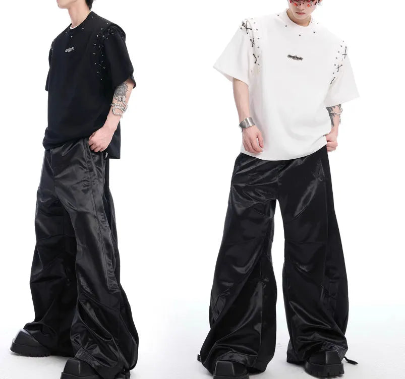 Black short sleeve T-shirt with a side cutout and white lace-up fastening detail.