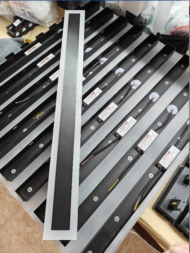 150cm long straight outdoor LED wall light with black wrought iron housing and IP65 waterproof rating.