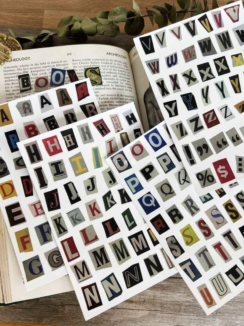 Decorative sticker sets showing English letters, numbers, and week words in colourful printed designs for crafting and labelling