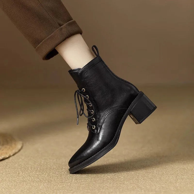 Women's black pointed toe short tube boots with 5.5cm block heel and ankle shaft height