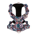 Floral pattern pure cotton dog chest harness shown on a model, demonstrating the pull-resistant strap design.