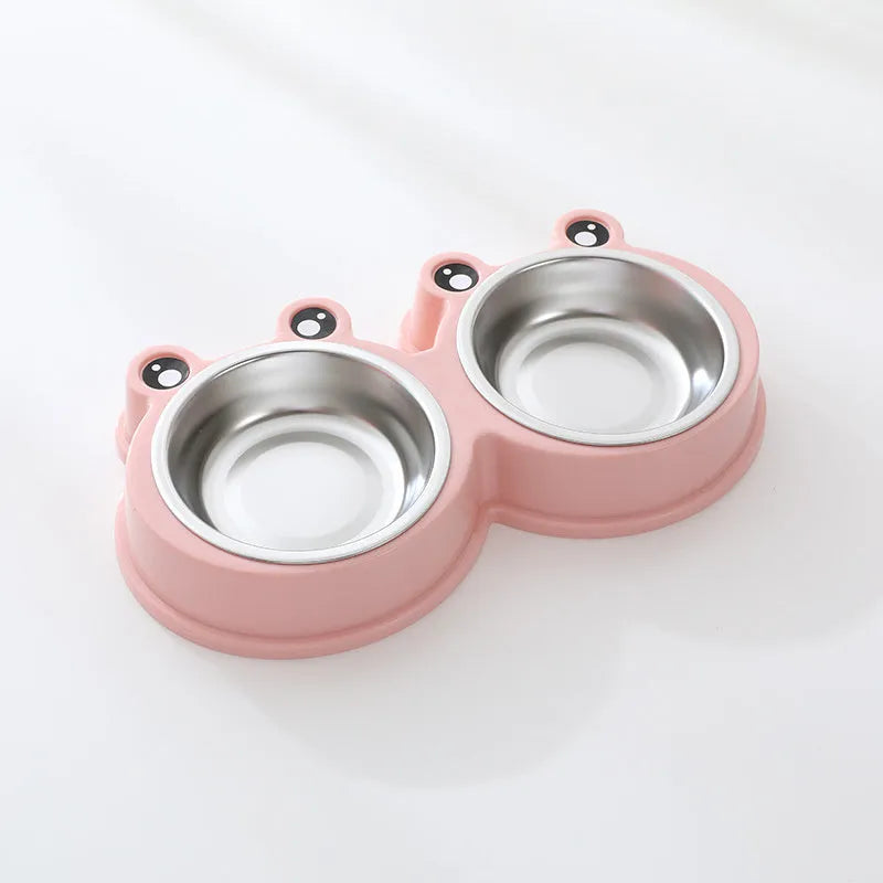 Stainless steel frog-shaped double bowl for pet food and water in blue, green, or pink.