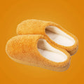 Furry suede thickened non-slip bedroom slippers in caramel colour on tiled floor