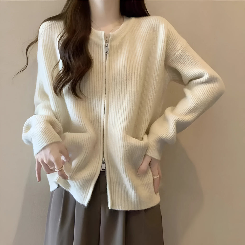 Beige viscose knit cardigan coat with long sleeves on a hanger.