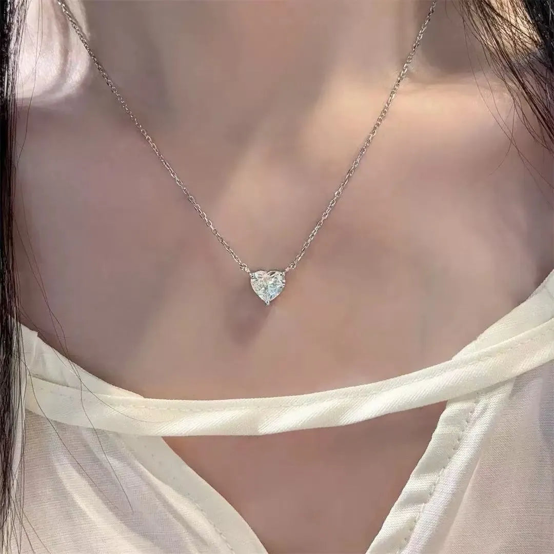 Women's silver heart necklace with copper construction and simple pendant design