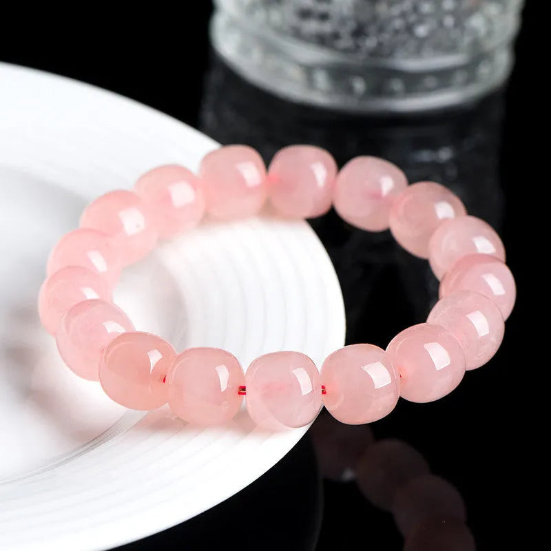 Pink barrel-shaped crystal bead bracelet with polished finish and original geometry design