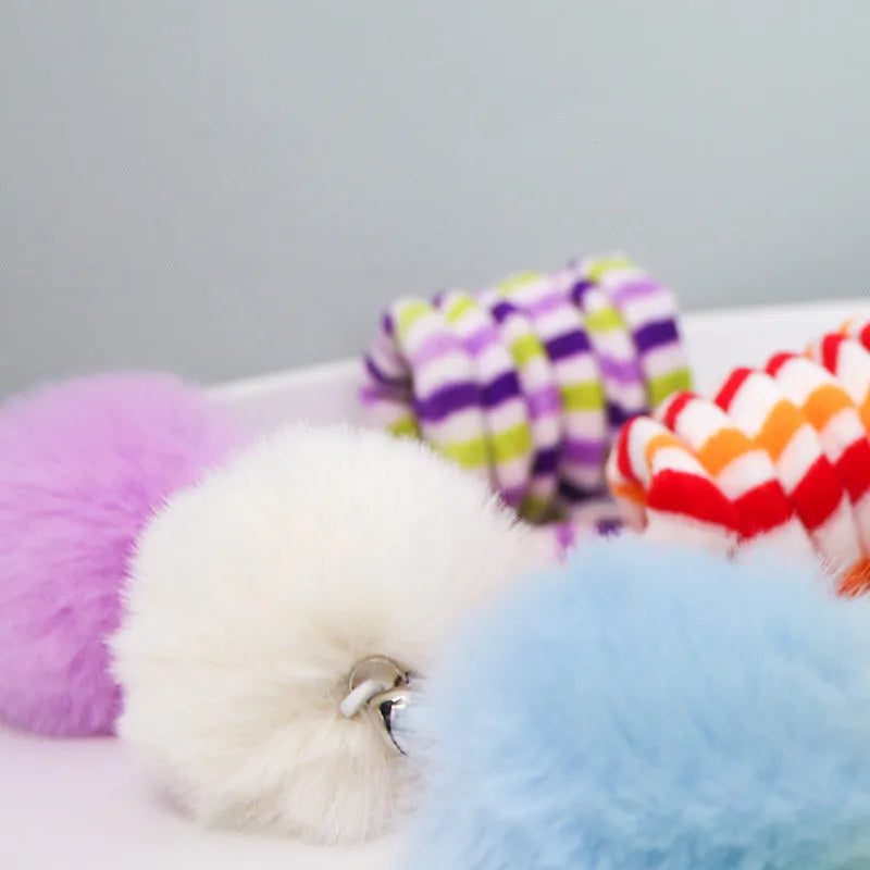 Hanging cat toy with bell stick and inflatable ball attached to door with suction cup
