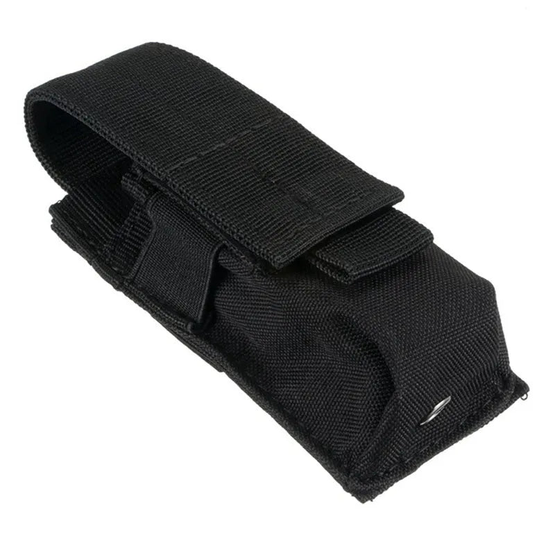 Black tactical Molle waist bag with elastic cord closure, shown next to a pistol cartridge for scale.
