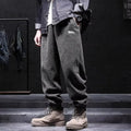 Grey men's straight-leg sweatpants with an ankle tie fastening on the hem.