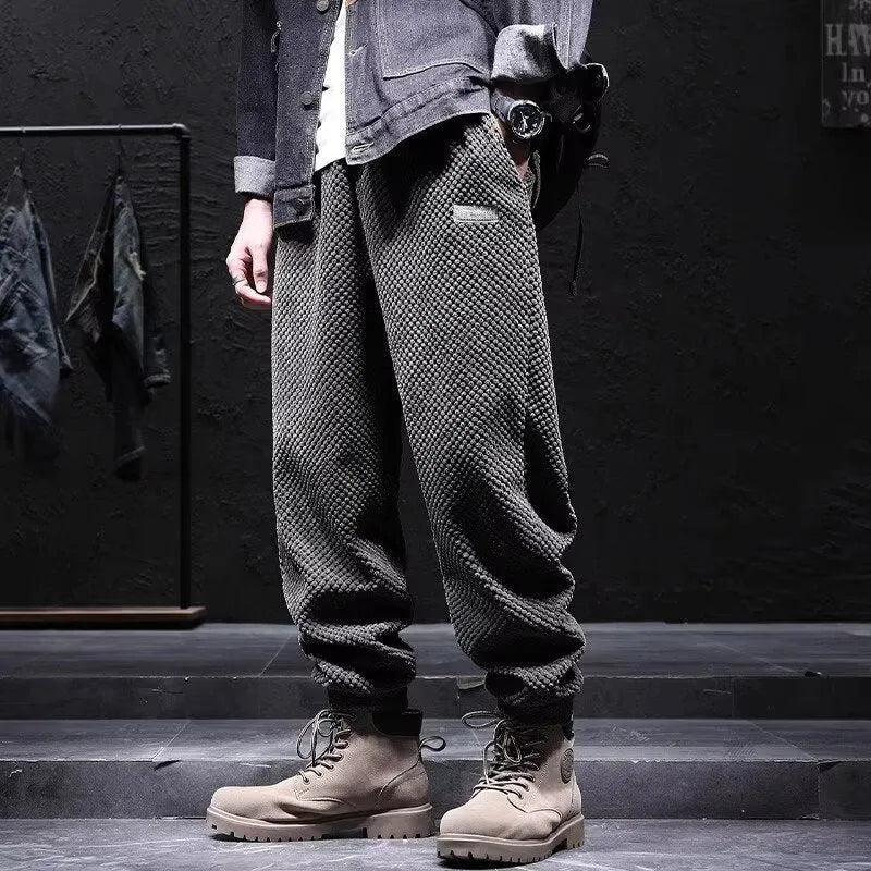 Grey men's straight-leg sweatpants with an ankle tie fastening on the hem.