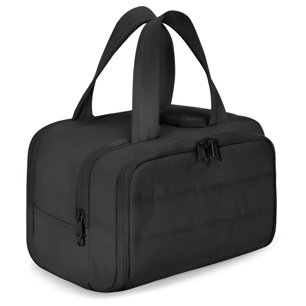 Large lightweight travel toiletry bag in black with wide opening, showing fluffy polyester material.