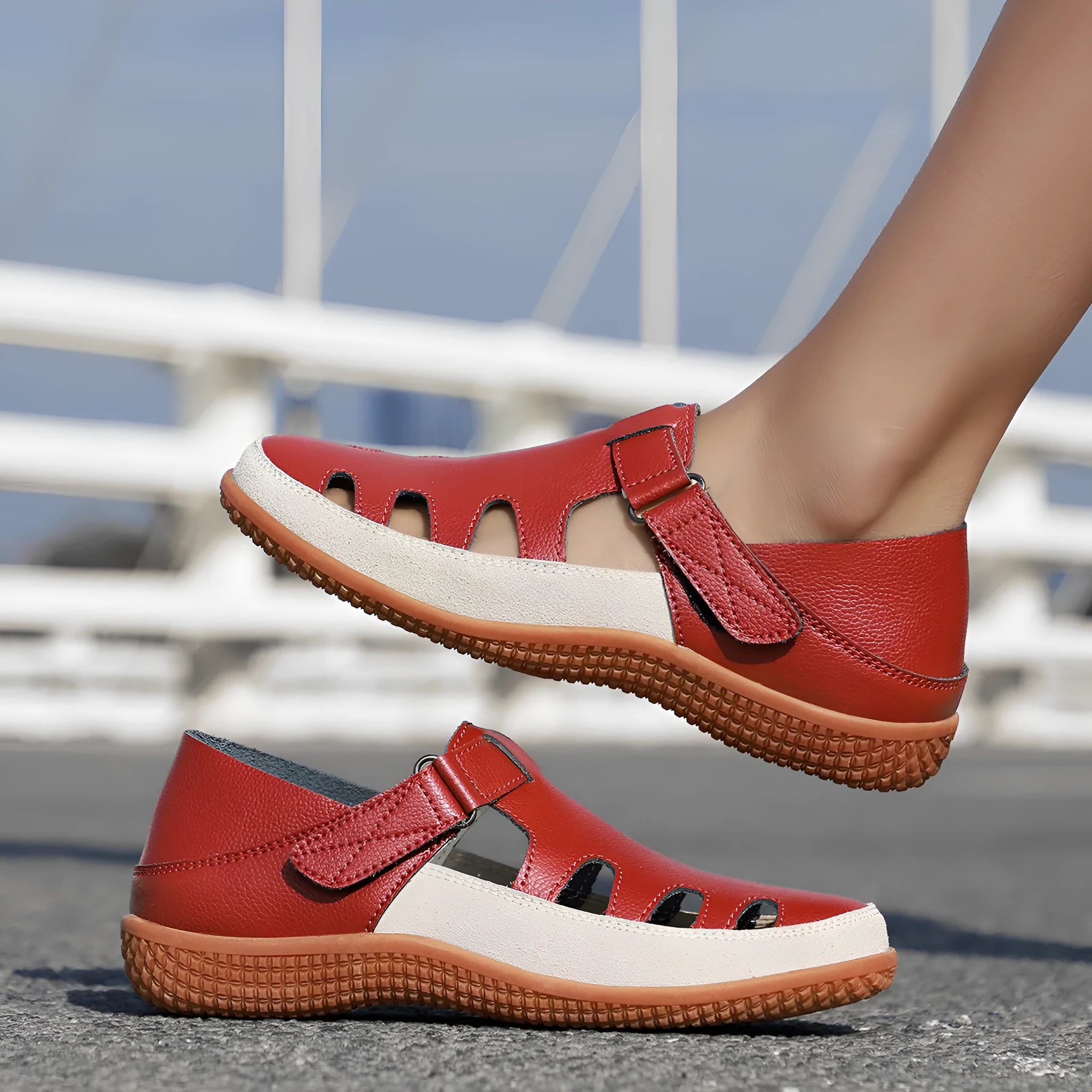 Women's plus size flat sandals in blue with hollow toe cap and breathable design on a thick rubber sole.