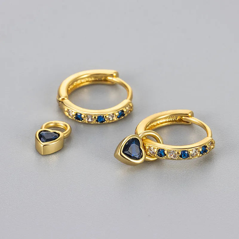 Women's heart-shaped ear clips with a coloured stone, available in gold or white gold colour.