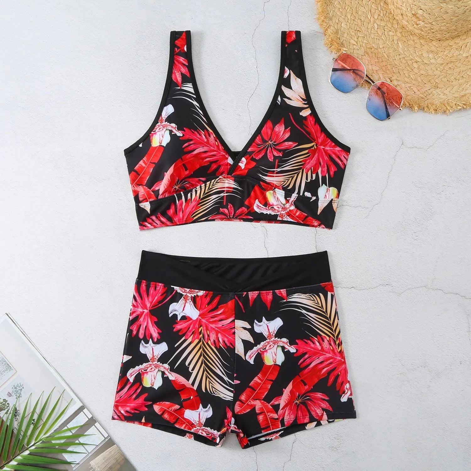 Women's two-piece swimsuit set with sleeveless top and printed boxer-style briefs in multiple colours.