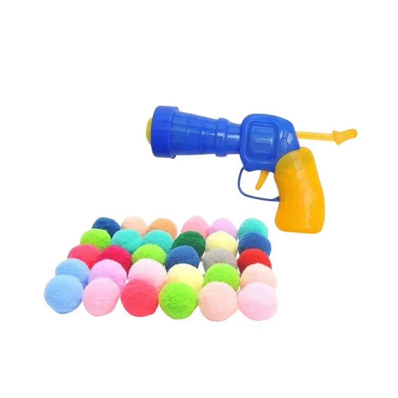 Pet toy launcher gun with assortment of soft plush balls for dog fetching games