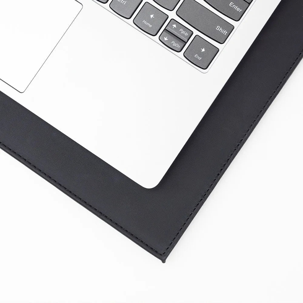 A heat-insulating anti-radiation tablet pad in blue colour with a non-slip base, placed under a laptop.