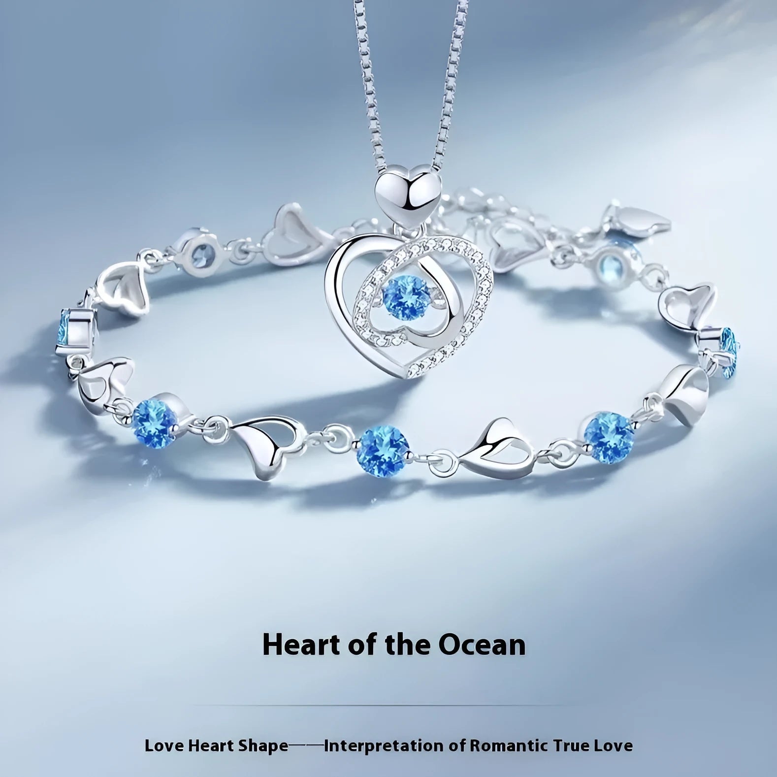 Blue diamond heart pendant necklace and matching bracelet jewellery set on copper