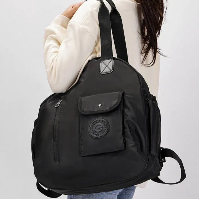 Outdoor lightweight backpack with nylon construction showing sandwich pocket design and available colour options