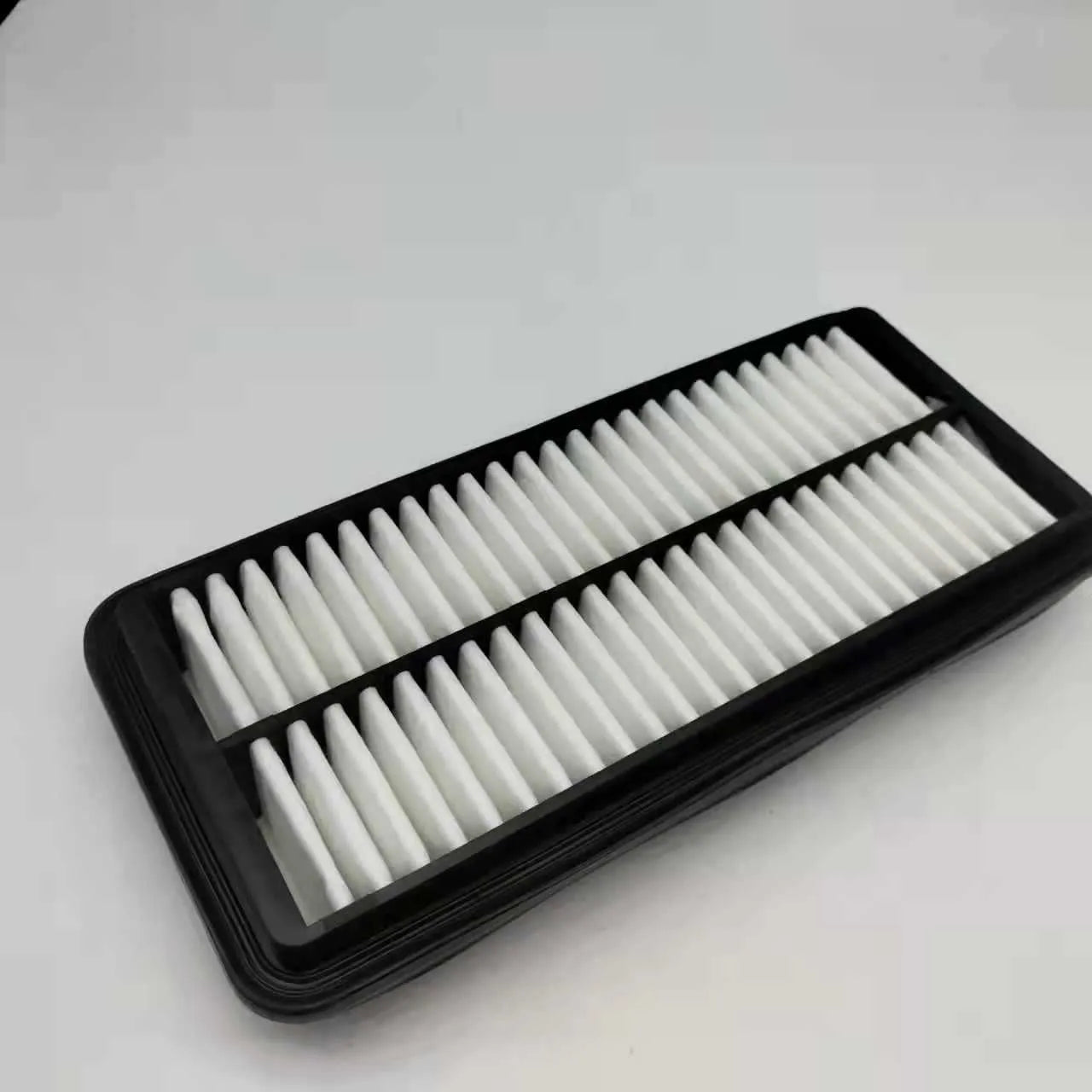 Rectangular black car air filter measuring 256mm by 113mm by 40mm for Modern vehicle applications