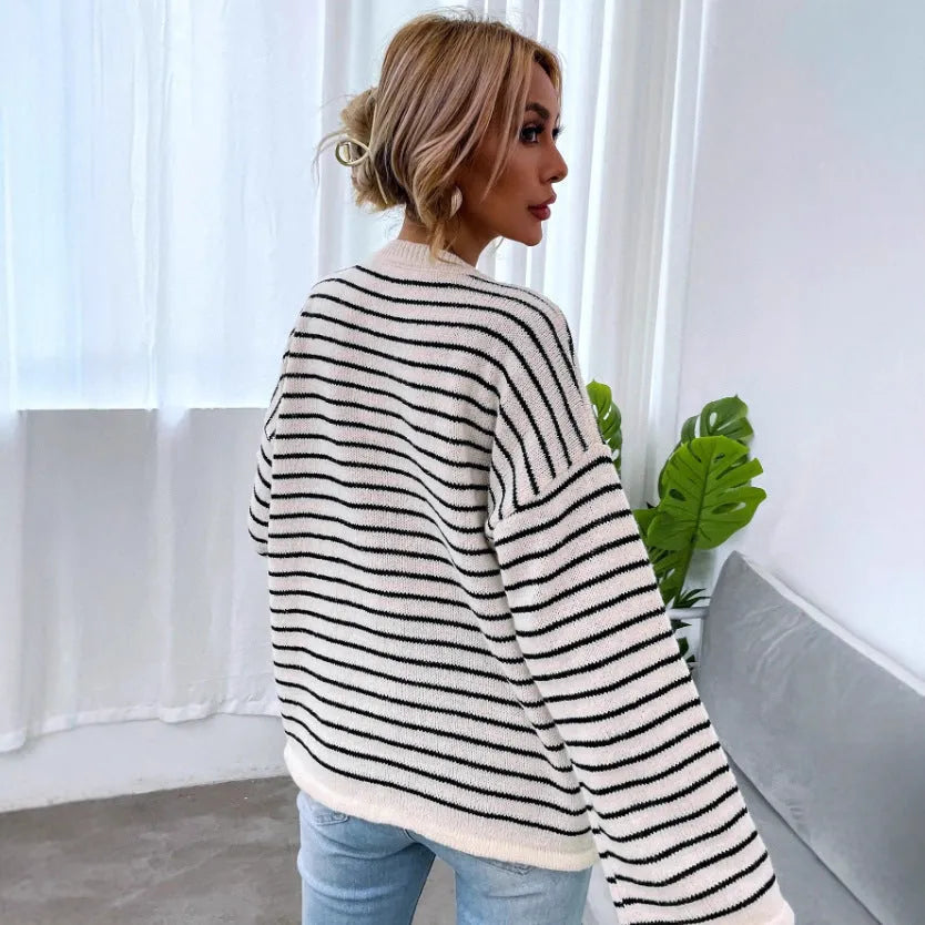 Black and white striped women's casual top with contrast colour detailing and drop-shoulder sleeves