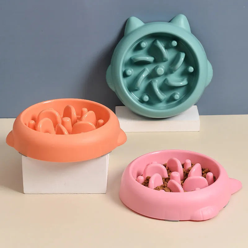 Bone-shaped slow feeder pet bowl in PP plastic showing interior maze design for slower eating