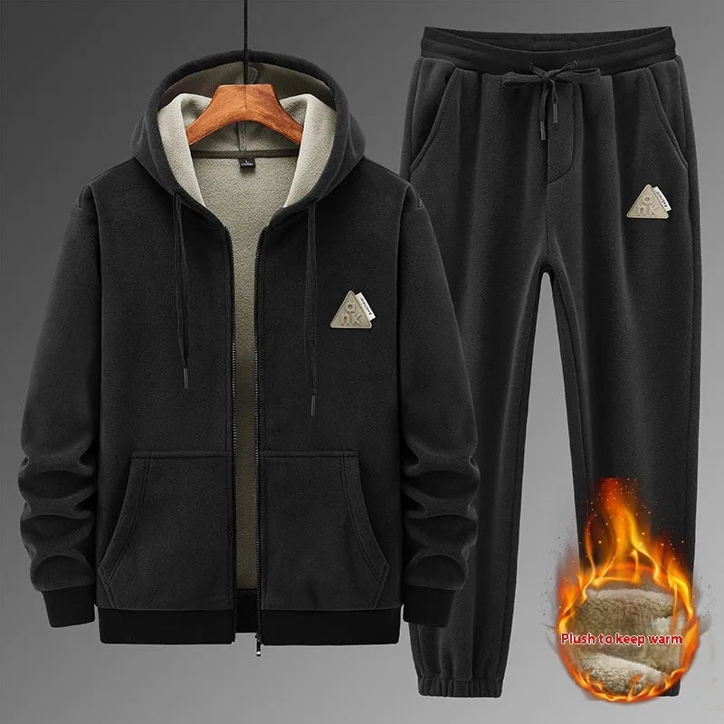Casual grey sports suit set with a hooded cashmere-feel sweater and matching cotton-look pants on a hanger.