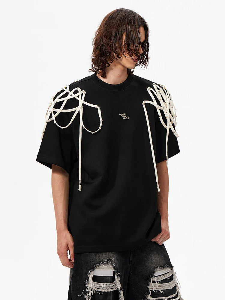 Black loose-fit short-sleeved T-shirt with a decorative rivet and ribbon padded shoulder detail.