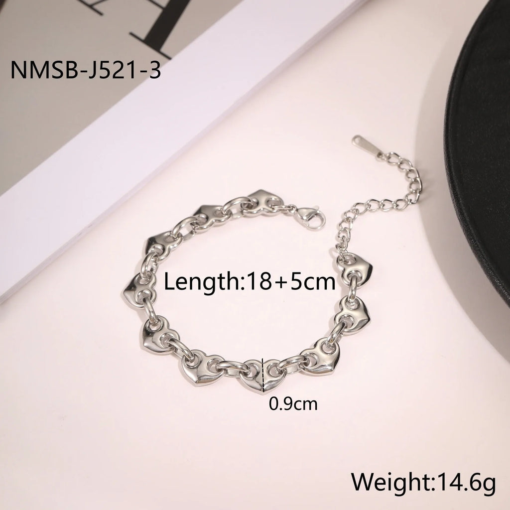 Women's geometric hollowed-out heart bracelet in stainless steel, available in gold or steel colour.