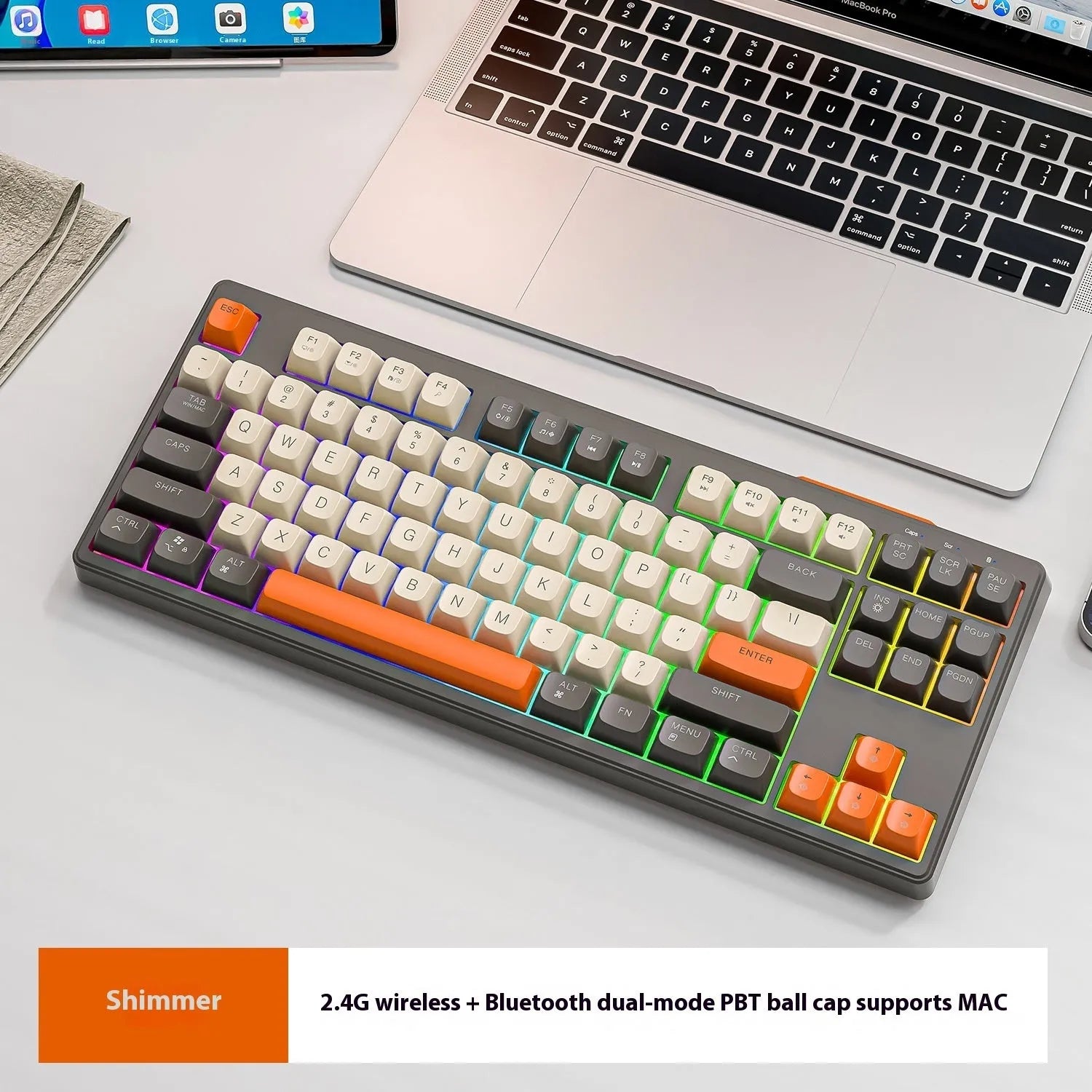 Free Wolf M87 wireless Bluetooth keyboard in blueberry colour on a desk with USB receiver and cable.