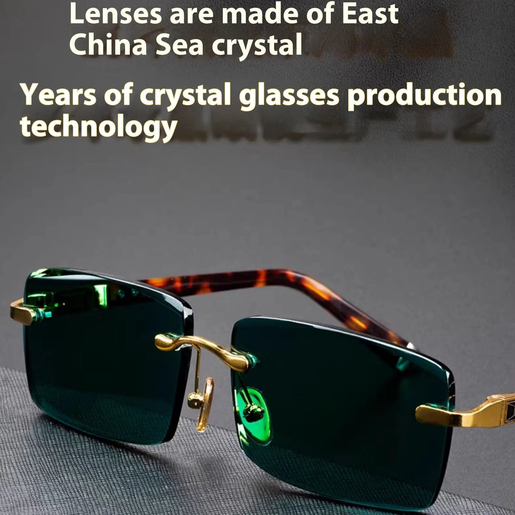 Dark green frameless crystal sunglasses shown with a glasses case and lens cloth.