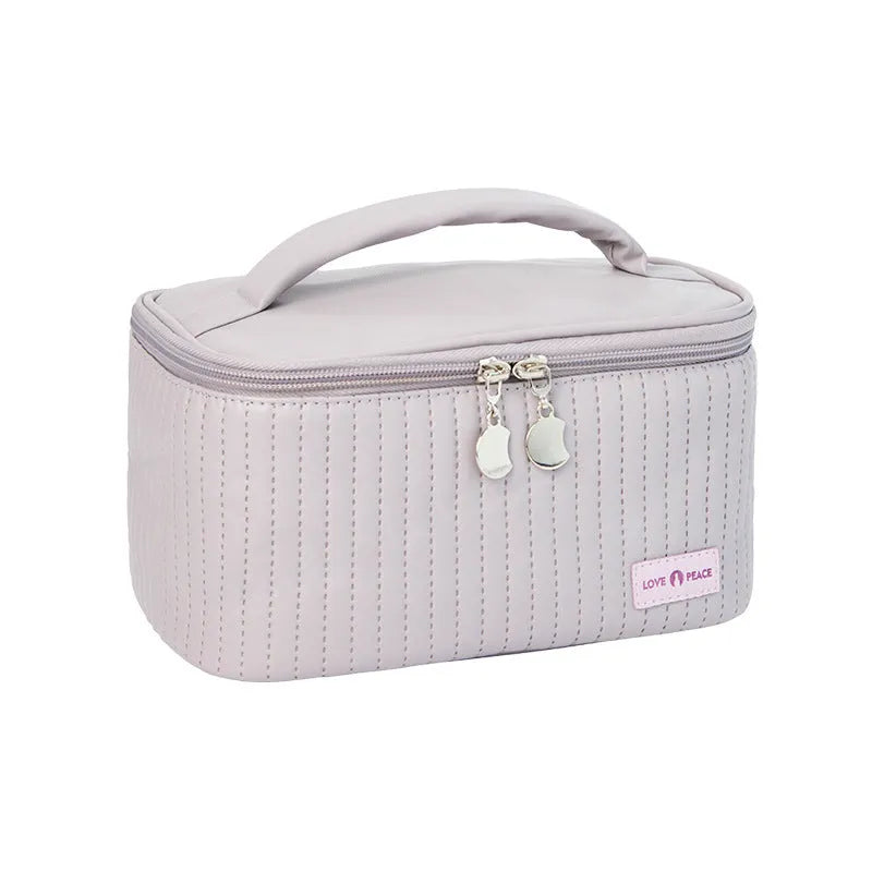 Open-top makeup bag in PU leather showing six colour options including pink, coffee, and light blue