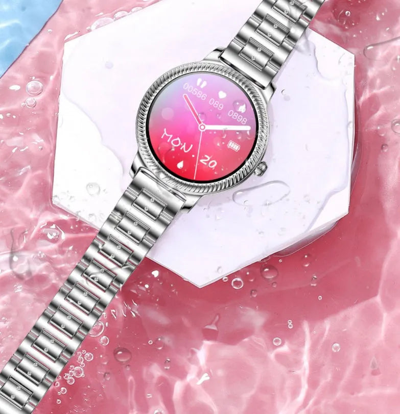 AK38 ladies smart watch with stainless steel Milanese band and 1.09-inch colour screen displayed on a wrist.