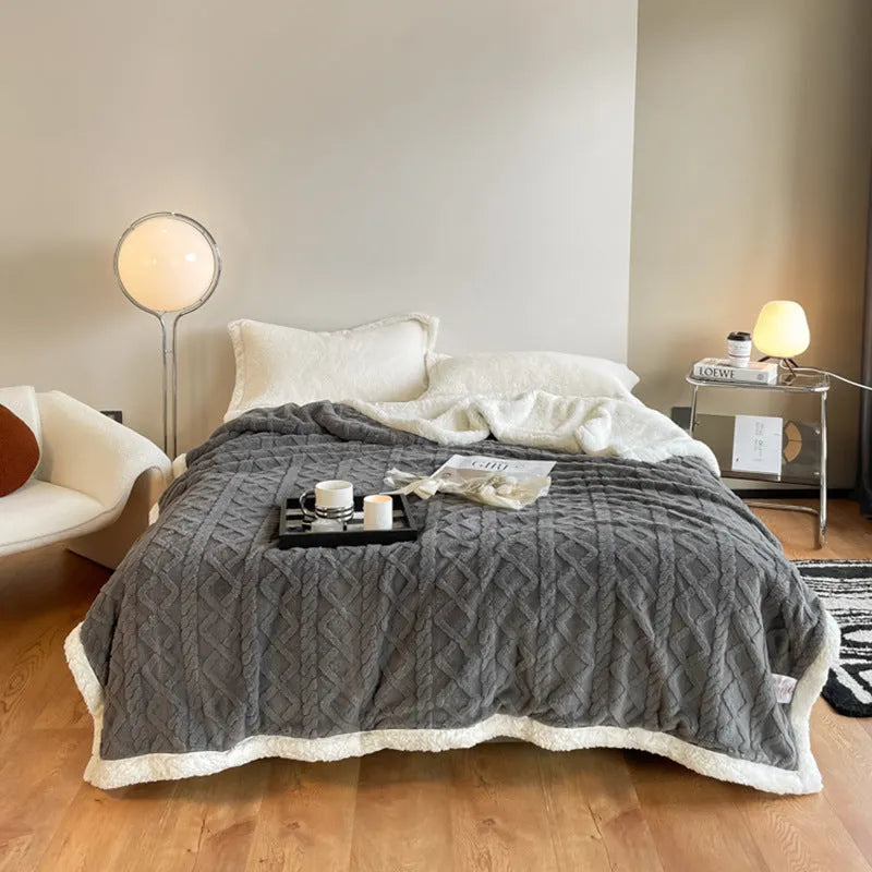 Polyester thermal flannel blanket in beige, folded to show texture and size.