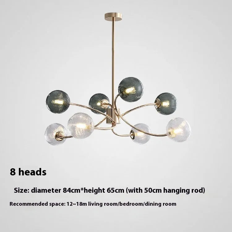 Modern Nordic style multi-head pendant chandelier with green clear lights for a living room.