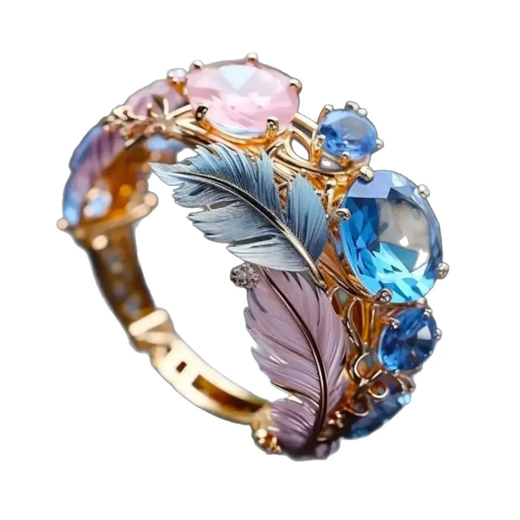 Brass geometric feather ring with embossed colourful design and inlaid zircon stones