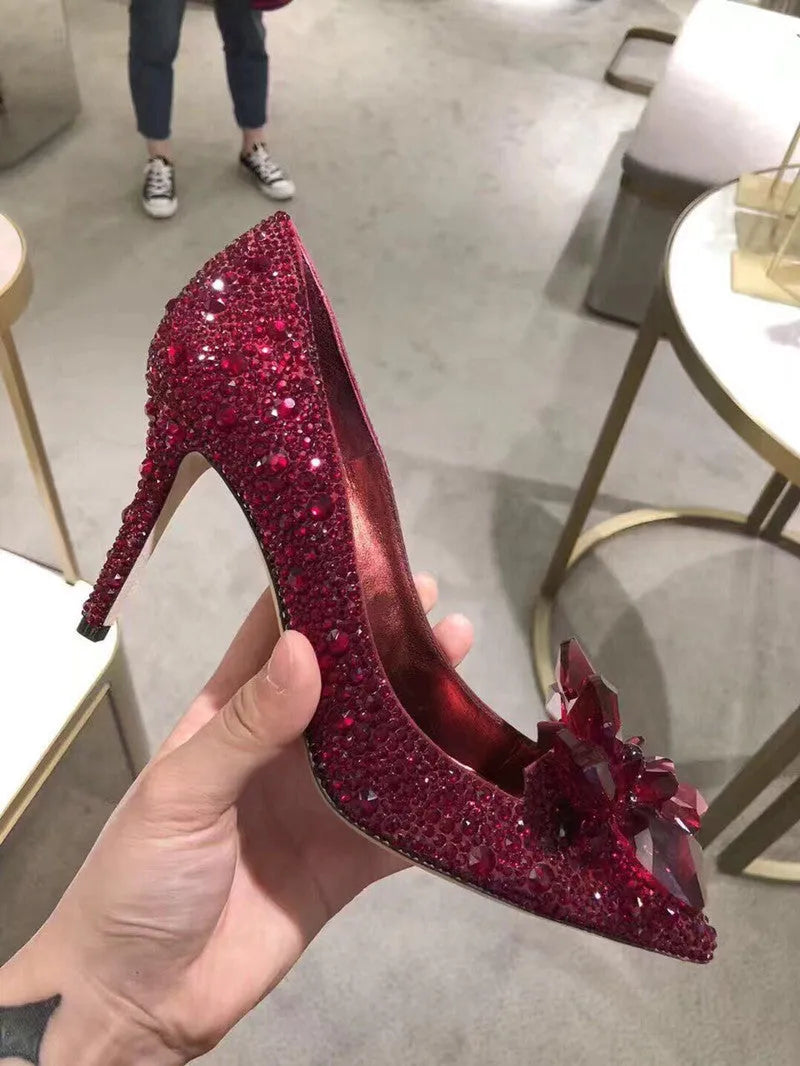 Women's gold high heels with pointed toes, rhinestone decoration, and stiletto heel
