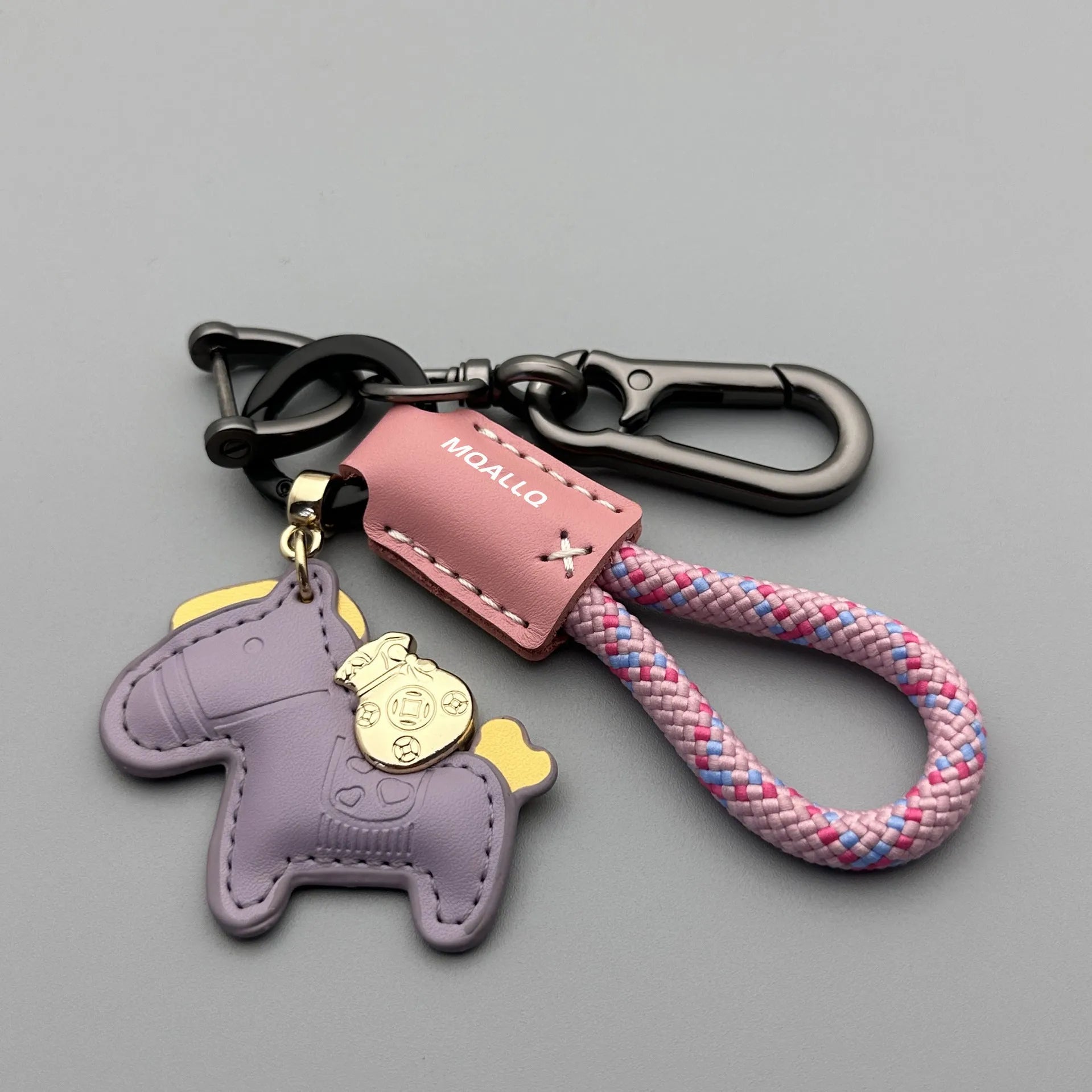 Handmade brown cowhide leather car key ring pendant with a zinc alloy belt buckle and green flanelle rope.