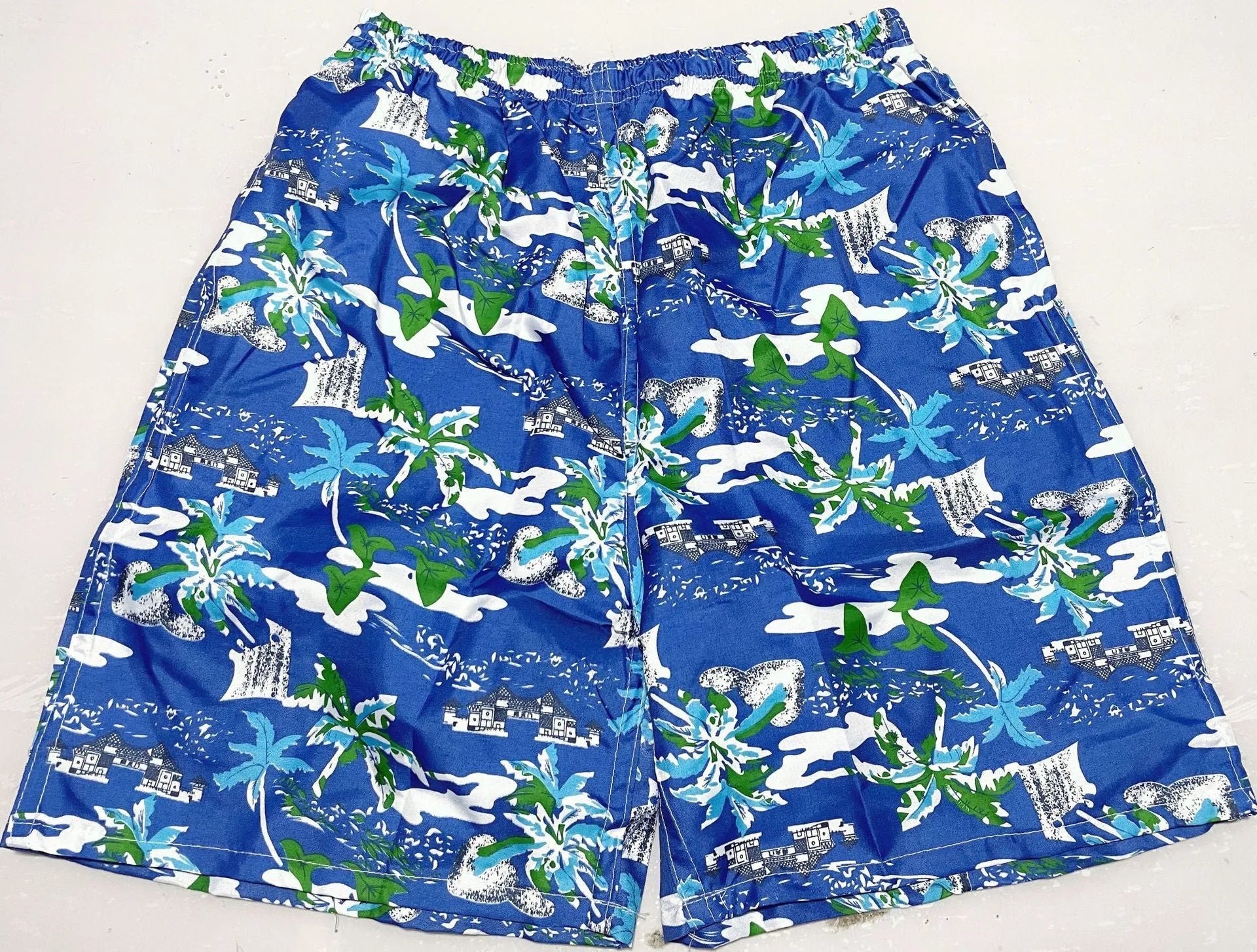 Men's floral printed swimming trunks with five-point design in quick-dry polyester material
