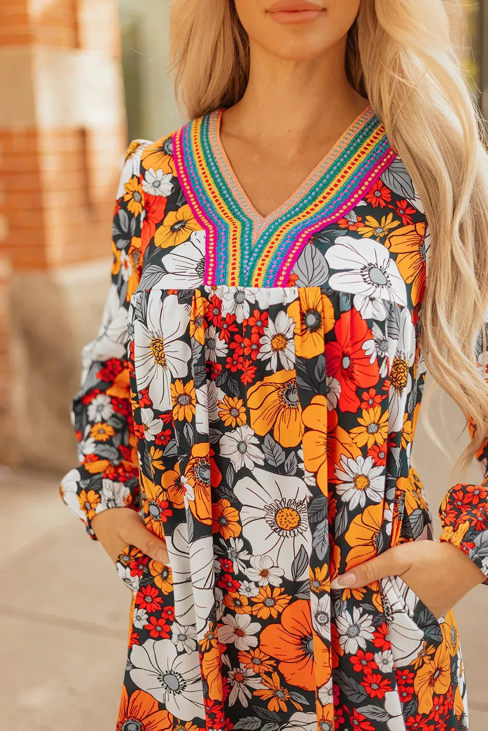 Orange floral print V-neck mini dress with striped lace detailing and long sleeves