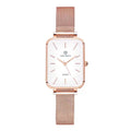 Women's rose gold waterproof quartz watch with woven steel band on wrist.