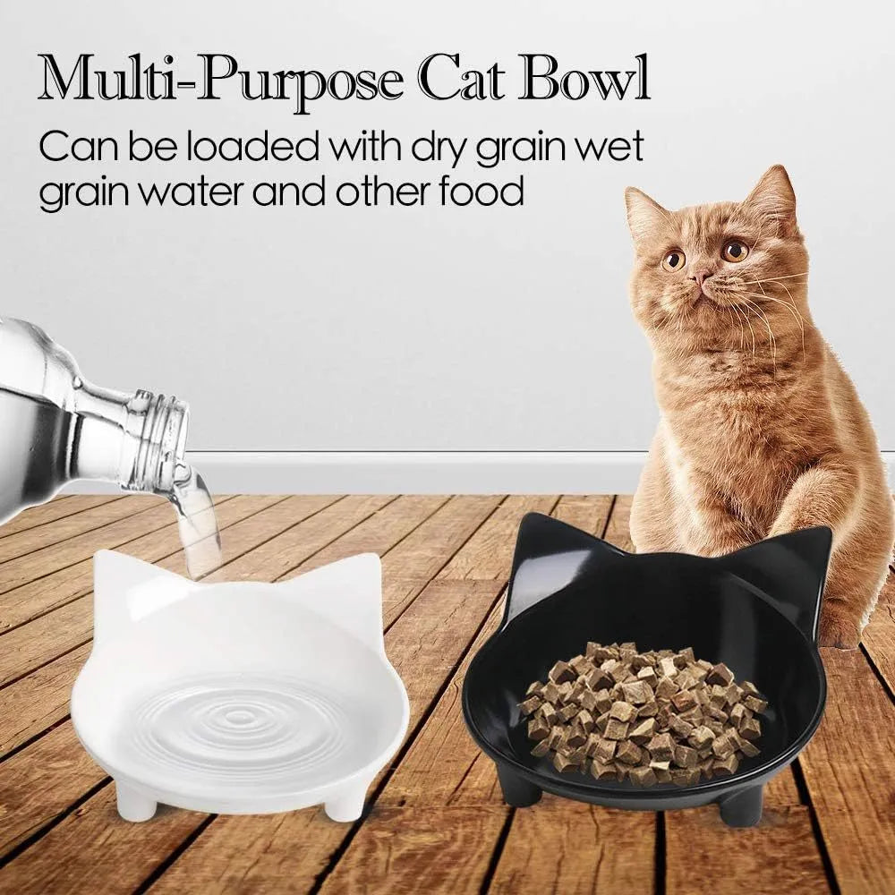 White and black shallow melamine pet bowls with non-slip rubber bases on a floor.