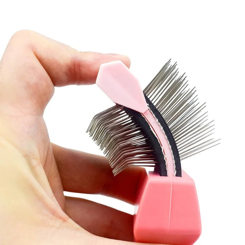 Double-sided stainless steel pet brush with blue handle showing both flexible and firm pin sides