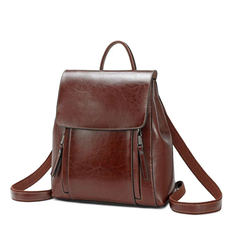 Genuine leather women's backpack in black with multiple compartments and dual shoulder straps