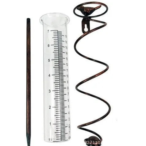 Cast iron garden hyetometer with glass rain gauge showing hummingbird design and measurement scale