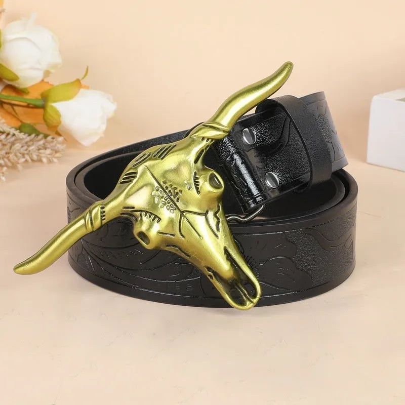 Men's brown leather-look belt with a detailed metal cow head buckle showing carved and embossed details.