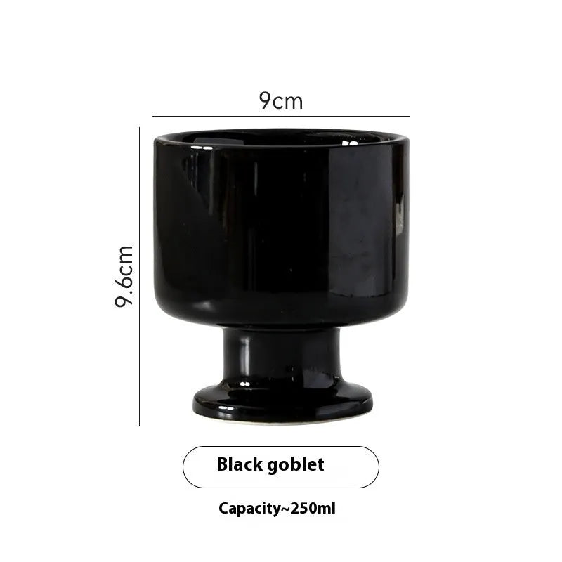 Hand-pinched irregular shaped ceramic mug in a solid colour, shown from the side.