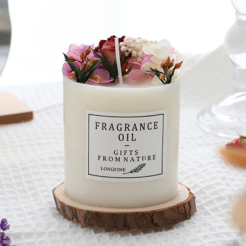 Glass jar scented candle with dried flower decoration, available in multiple fragrance options