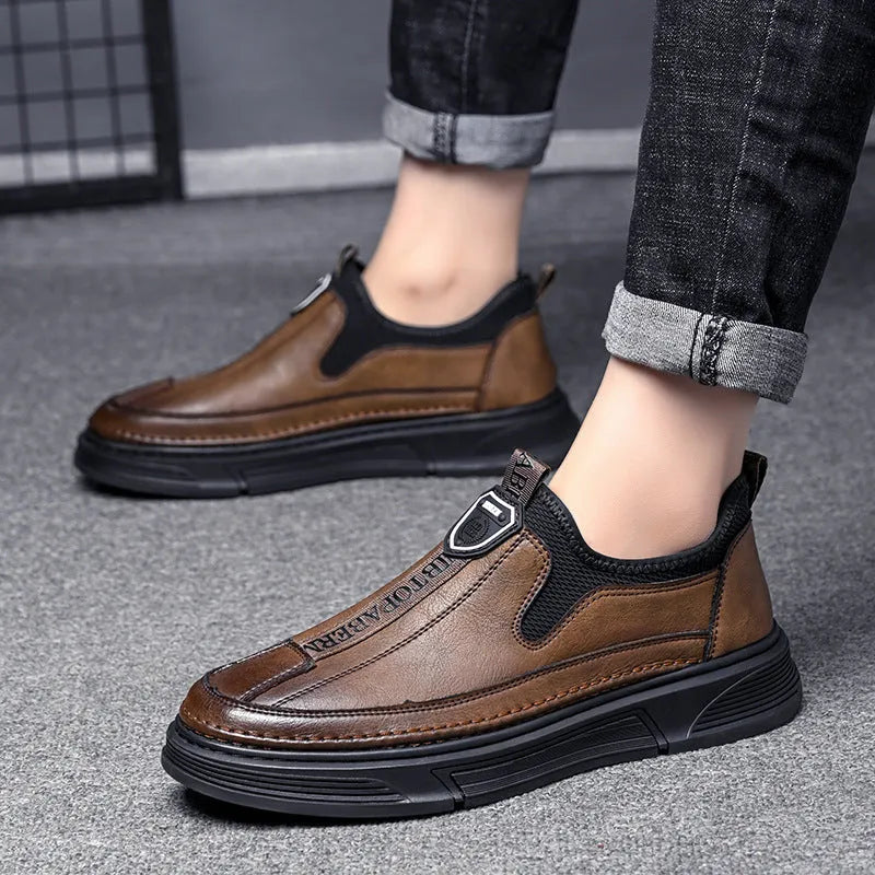 Men's black leather casual shoes with a round toe on a white background.